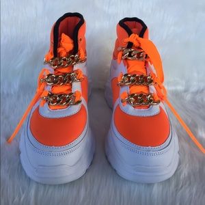 Women's Neon Orange High-top shoes.
